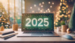 © Viktoriia - Laptop with numbers 2025 on the screen on a desktop and Christmas tree with lights in the background