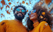 © BOTAHRY DEX - Afro couple throwing autumn leaves, walking in a park, and having fun