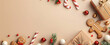 © Jana - Christmas background with red and beige decorations on the edges, candy canes, gingerbread cookies, stars, ornaments, on light brown surface, flat lay photograph with copy space