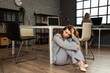 © Pixel-Shot - Young woman having panic attack in office