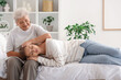 © Pixel-Shot - Happy senior woman and her granddaughter resting in bedroom at home