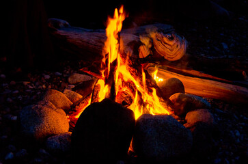 glow wood in fireplace close up with flame