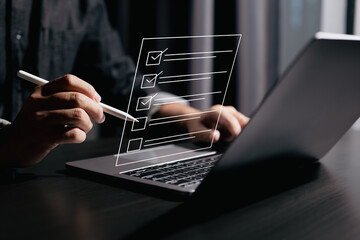 Fototapete - Organizing a digital checklist on a laptop, ensuring every task is completed