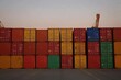 © Smart AI - Colorful Shipping Containers Stacked in an Industrial Storage