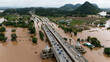Aerial view of car driving on the bridge after road flooded during typhoon Yagi has swept Chiang Rai province of Thailand.