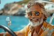 © btiger - Happy senior man driving cabriolet by the sea on summer vacation, enjoying free and luxury road trip in Italy