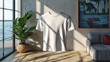 © julio - A white t-shirt displayed in a modern, sunlit living space.