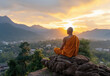 © PRASANNAPIX - A monk with no hair in meditates on the top of a mountain