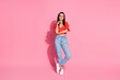 © deagreez - Full body portrait of nice young lady empty space wear top isolated on pink color background