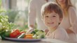 © nuiiko - A cheerful child smiles at the camera, surrounded by fresh vegetables, with parents in the background, highlighting family togetherness and healthy eating.