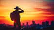 © Daniel - Travel Concept. Silhouette of a man with a backpack against bright sky sunset. Sun goes down. A man looks ahead, straightens his cowboy hat. Cityscape night view in the background. Color toning filter
