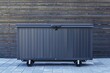 © Your Choice - Outdoor storage box on wheels placed against a wooden fence on a sunny day