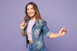© ViDi Studio - Side view young smiling happy woman she wear denim jacket violet top casual clothes look camera raise up hands dance isolated on plain pastel light purple background studio portrait Lifestyle concept