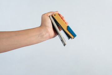 Wall Mural - Stapler in hand isolated on white background