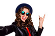 © deagreez - Close up photo of addicted funny heavy metal blogger enjoy party make selfie show two fingers horned signs wear black leather good look outfit isolated over yellow color background