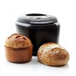 © Kavita - An innovative bread maker on a white background, with a loaf of bread beside it.