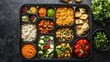 © savittree - Indian lunchbox with assorted dishes, colorful, rich in texture, neatly arranged compartments.