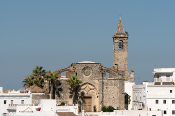 Panoramic view of the white beautiful village of Vejer de la Frontera Divino and the Salvador church in the background at sunset, Cadiz province, Andalusia, Spain