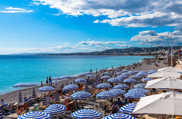 Promenade des Anglais beach and its parasols in Nice, French Riviera, Provence Alpes Côte d'Azur, France