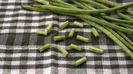 French beans with stewed green peas on wooden background. Healthy food concept.