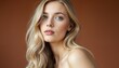 © schiers_images - Close-up portrait of a young woman with long, soft blonde hair and calm expression, set against a warm brown background.