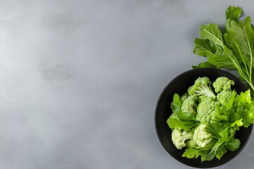 Sticker - A vibrant and healthy arrangement of fresh Romanesco cauliflower and leafy greens in a black bowl, symbolizing natural goodness, fresh produce, nutritious food, culinary creativity, and a healthy life