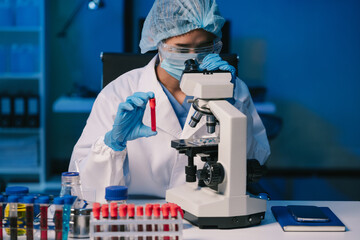 Science and medicine, scientist analyzing and dropping a sample into a glassware, experiments containing chemical liquid in laboratory on glassware, innovative and technology.