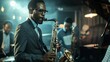 © VK Studio - A jazz musician passionately plays the saxophone, with band members accompanying in an atmospheric, dimly-lit venue.