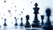 © Oatkhaphon - A close-up of black chess pieces with a focus on a king and pawn, set against a blurred background, symbolizing strategy and competition.