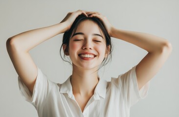 Portrait of a Smiling Young Woman in a White Shirt