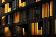 © Egor - A modern apartment building with a dark wood facade and warm golden light filtering through the windows.