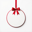 © MD NAZMUL - White Round Christmas Ball Tag Hanging with Shiny Red Ribbon and Bow, Isolated on White Background, Christmas Decoration Template