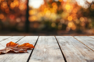Poster - Empty wooden table showing autumn background with copy space