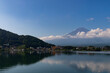 © Larry - Title: Beautiful image of Mount Fuji shot across Lake Kawaguchi. The water is very reflective. The clouds floating past the mountain makes this look like a magical image. This was taken is Fujiyoshida
