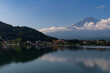 © Larry - Title: Beautiful image of Mount Fuji shot across Lake Kawaguchi. The water is very reflective. The clouds floating past the mountain makes this look like a magical image. This was taken is Fujiyoshida