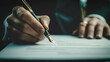 © Kolapatha - Close-up professional signing formal document with fountain pen, symbolizing agreement, business transactions, or legal formalities. Professionalism, commitment, and attention to detail