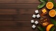 © Panupan - Orange Cocktail with Ice Cubes on Wooden Background