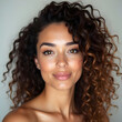 © peemee19 - Portrait of a young woman with curly hair.