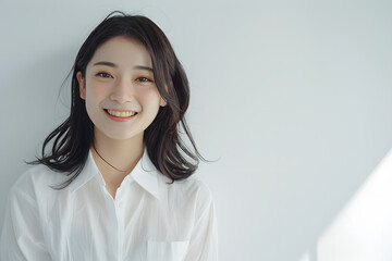 Oriental woman smiling on white background