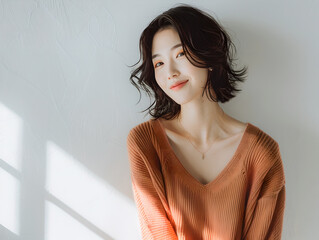 Oriental woman smiling on white background