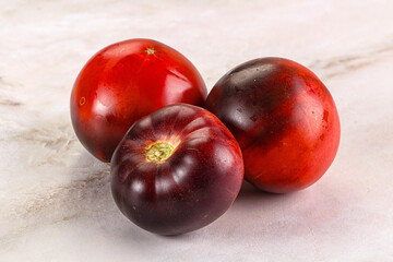 Black ripe juicy organic tomato