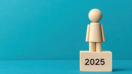 Wooden figure representing the year 2025 on a blue background.