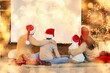 © Pixel-Shot - Happy family in Santa hats watching Christmas movie on projector screen at home, back view