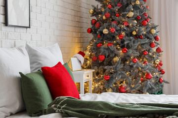 Canvas Print - Cozy bed and Christmas tree in interior of festive bedroom