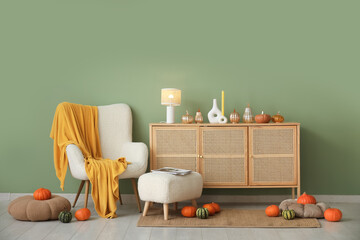 Canvas Print - Autumn interior of living room with white armchair, lamp, pumpkins and chest of drawers