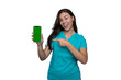 © PeopleVideos - Confident young nurse in scrubs using a smartphone featuring a green screen