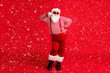 © deagreez - Full length body size view of his he nice handsome cheery comic childish flirty Santa father having fun celebratory festal day showing v-sign isolated bright vivid shine vibrant red color background