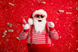 © deagreez - Photo of pensioner old man grey beard raise fists open mouth money shower wear santa x-mas costume suspenders sunglass gloves striped shirt cap isolated red color background
