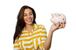 © PeopleVideos - Girl saving money with a piggy bank in her hand