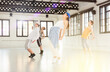 © JackF - Active teenage dancers having contemporary dance training at dance hall